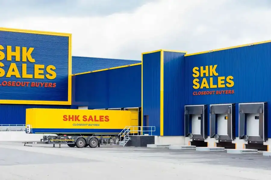 The SHK Sales warehouse with a yellow trailer at the loading dock